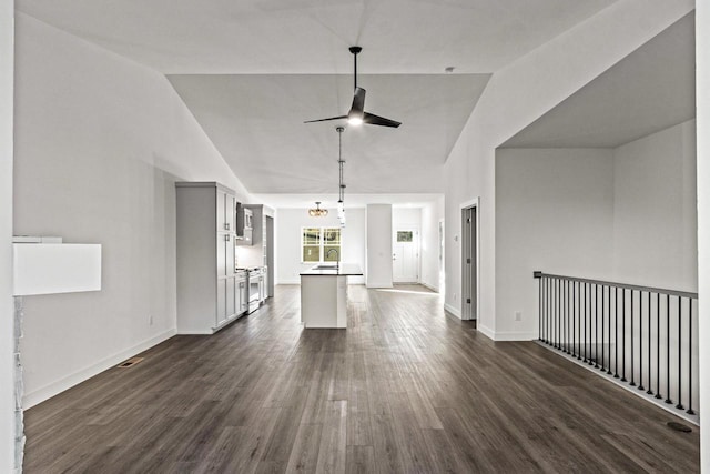 28 Sienna Hills Cir, Mount Horeb, WI 53572 - unfurnished living room featuring a ceiling fan, a sink, dark wood finished floors, baseboards, and high vaulted ceiling