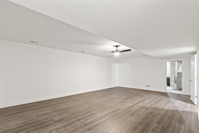 28 Sienna Hills Cir, Mount Horeb, WI 53572 - unfurnished room with dark wood finished floors, ceiling fan, and baseboards