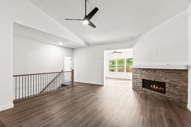 28 Sienna Hills Cir, Mount Horeb, WI 53572 - unfurnished living room featuring a ceiling fan, a stone fireplace, high vaulted ceiling, wood finished floors, and baseboards