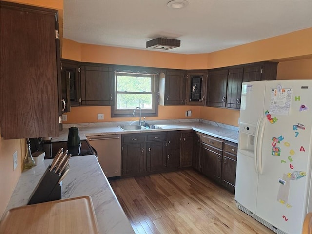 2626 Abbe Hill Dr, Eau Claire, WI 54703 - kitchen with white refrigerator with ice dispenser, a sink, dishwasher, light wood-type flooring, and dark brown cabinetry