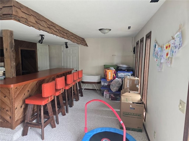 2626 Abbe Hill Dr, Eau Claire, WI 54703 - indoor dry bar with baseboards and carpet flooring