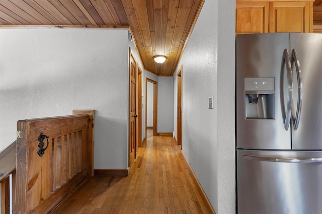 2104 Hazel St, Oshkosh, WI 54901 - hallway featuring wood ceiling, light wood-style flooring, a textured wall, and baseboards