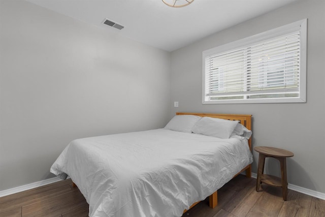 2104 Hazel St, Oshkosh, WI 54901 - bedroom featuring baseboards and wood finished floors