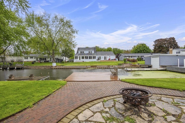 2104 Hazel St, Oshkosh, WI 54901 - view of patio / terrace with an outdoor fire pit, a water view, and a residential view