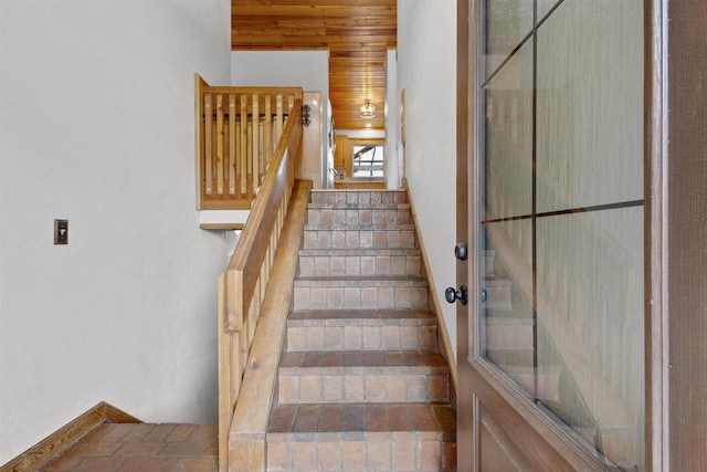 2104 Hazel St, Oshkosh, WI 54901 - stairs featuring wood ceiling and baseboards