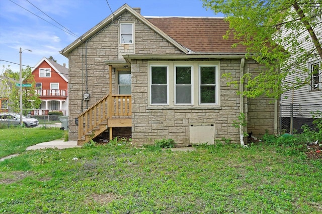 118 E Concordia Ave, Milwaukee, WI 53212 - rear view of house featuring stone siding and roof with shingles