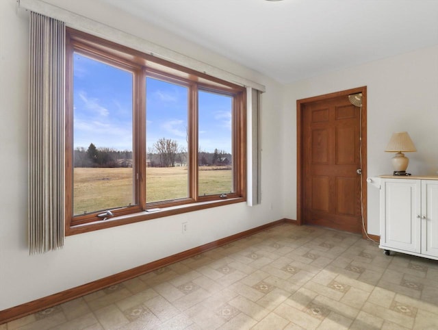 W11065 Menominee Rd, Portage, WI 53901 - empty room with plenty of natural light and baseboards