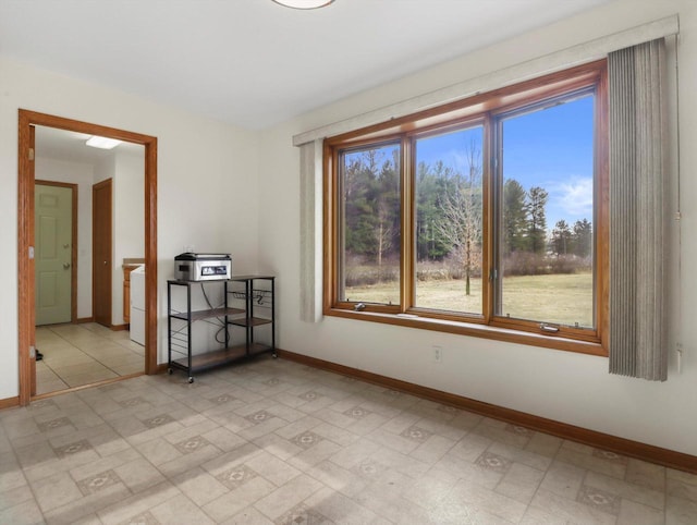 W11065 Menominee Rd, Portage, WI 53901 - empty room featuring baseboards and healthy amount of natural light