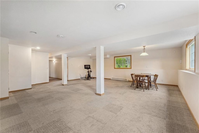 819 Fairway Cir, Black River Falls, WI 54615 - below grade area featuring a baseboard radiator, light colored carpet, baseboards, and recessed lighting
