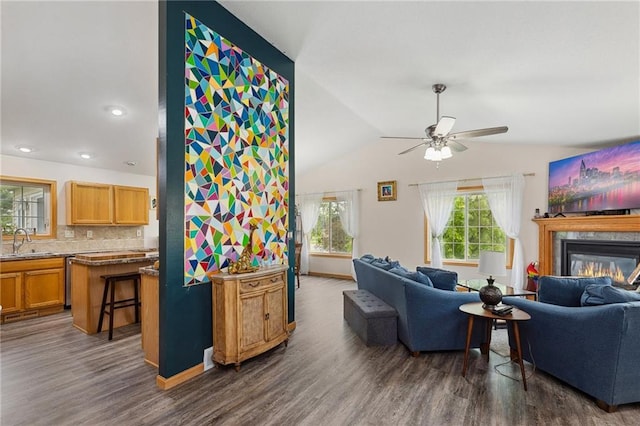 819 Fairway Cir, Black River Falls, WI 54615 - living room with ceiling fan, dark wood finished floors, lofted ceiling, a glass covered fireplace, and recessed lighting