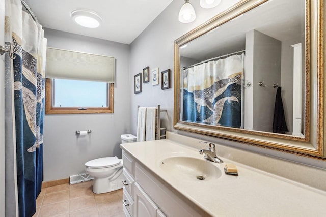 4912 Schofield St, Monona, WI 53716 - bathroom featuring vanity, toilet, tile patterned flooring, and baseboards