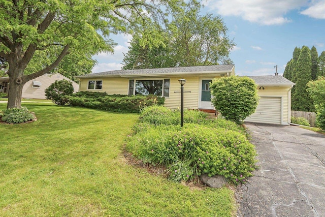 4912 Schofield St, Monona, WI 53716 - ranch-style house featuring an attached garage and driveway