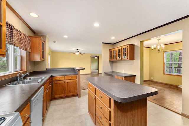 11253 State Highway 71, Sparta, WI 54656 - kitchen featuring a sink, dark countertops, white dishwasher, crown molding, and light floors