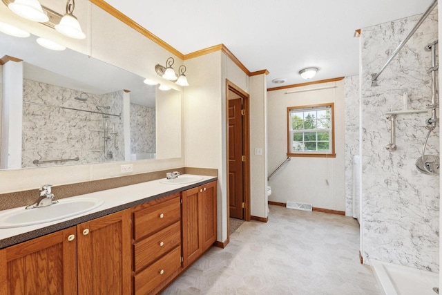11253 State Highway 71, Sparta, WI 54656 - bathroom with a marble finish shower, double vanity, toilet, and crown molding