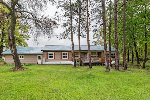 11253 State Highway 71, Sparta, WI 54656 - rear view of property with a yard, metal roof, and covered porch
