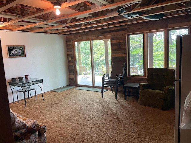 17235 Little Archibald Rd, Townsend, WI 54175 - sitting room with ceiling fan, wood walls, and carpet floors