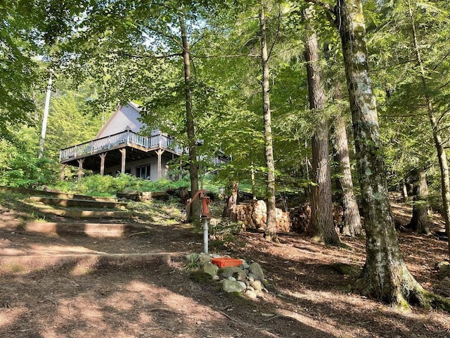 17235 Little Archibald Rd, Townsend, WI 54175 - view of yard featuring a wooden deck and a forest view