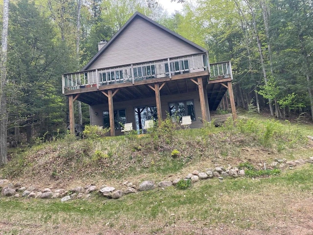 17235 Little Archibald Rd, Townsend, WI 54175 - back of property with a deck, a chimney, and a forest view