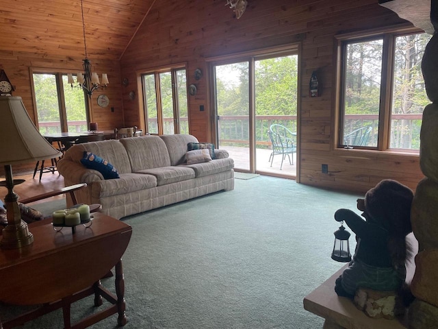 17235 Little Archibald Rd, Townsend, WI 54175 - living room with wood walls, vaulted ceiling, a chandelier, carpet floors, and wooden ceiling