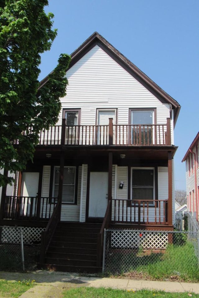 1817 N 22nd St Unit 1819, Milwaukee, WI 53205 - view of front of home with a balcony, a porch, and stairway