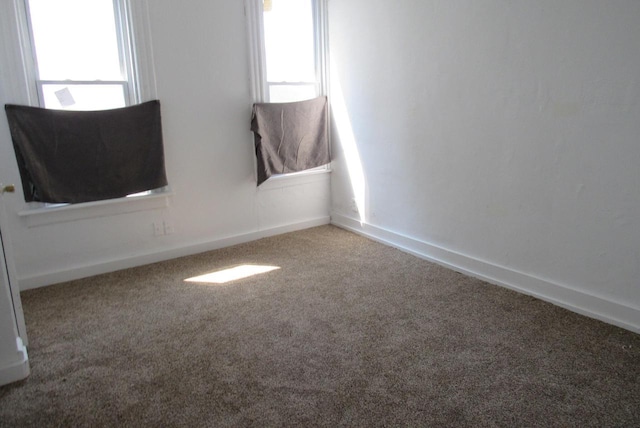 1817 N 22nd St Unit 1819, Milwaukee, WI 53205 - spare room featuring carpet floors, plenty of natural light, and baseboards