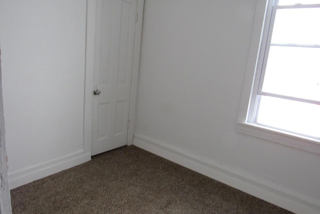 1817 N 22nd St Unit 1819, Milwaukee, WI 53205 - empty room featuring dark carpet and baseboards