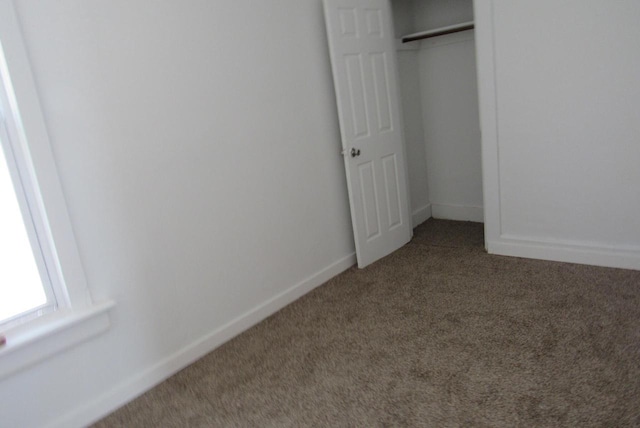 1817 N 22nd St Unit 1819, Milwaukee, WI 53205 - unfurnished bedroom featuring carpet flooring, baseboards, and a closet
