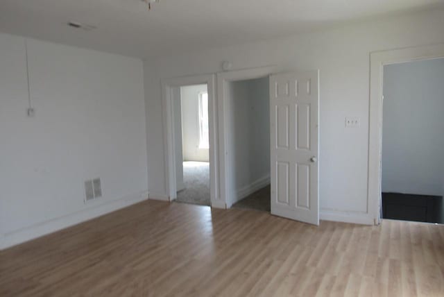 1817 N 22nd St Unit 1819, Milwaukee, WI 53205 - unfurnished room with wood finished floors and baseboards