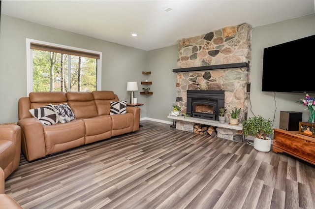 4892 N Mohawk Ave, Glendale, WI 53217 - living room with wood finished floors, a stone fireplace, and baseboards