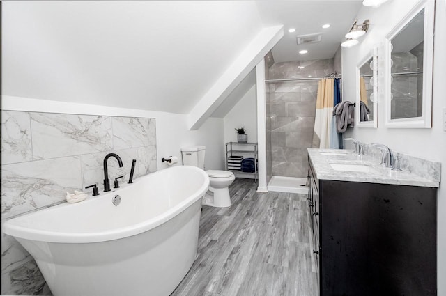 4892 N Mohawk Ave, Glendale, WI 53217 - bathroom featuring toilet, a shower stall, a soaking tub, double vanity, and recessed lighting