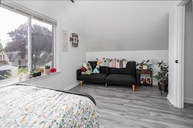 4892 N Mohawk Ave, Glendale, WI 53217 - bedroom featuring lofted ceiling, baseboards, and wood finished floors