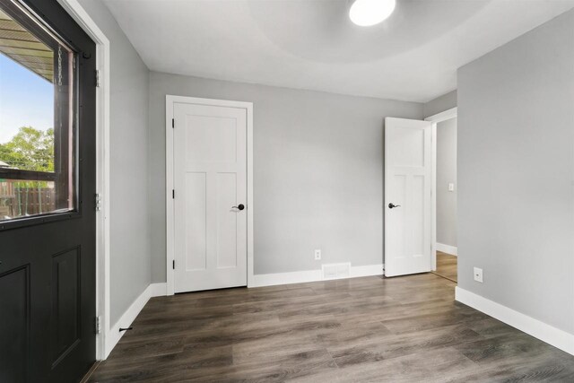1523 N Lynndale Dr, Appleton, WI 54914 - unfurnished bedroom with wood finished floors and baseboards