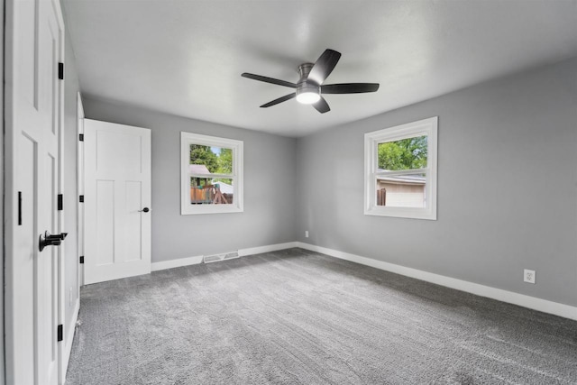 1523 N Lynndale Dr, Appleton, WI 54914 - unfurnished bedroom featuring baseboards, carpet flooring, and ceiling fan