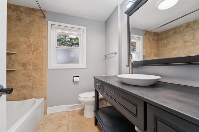 1523 N Lynndale Dr, Appleton, WI 54914 - full bath featuring vanity, toilet, baseboards, tile patterned flooring, and shower / bathtub combination