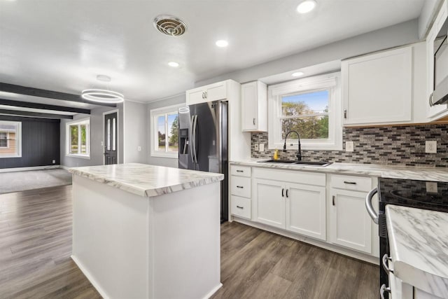 1523 N Lynndale Dr, Appleton, WI 54914 - kitchen with a sink, white cabinetry, decorative backsplash, stainless steel fridge, and recessed lighting