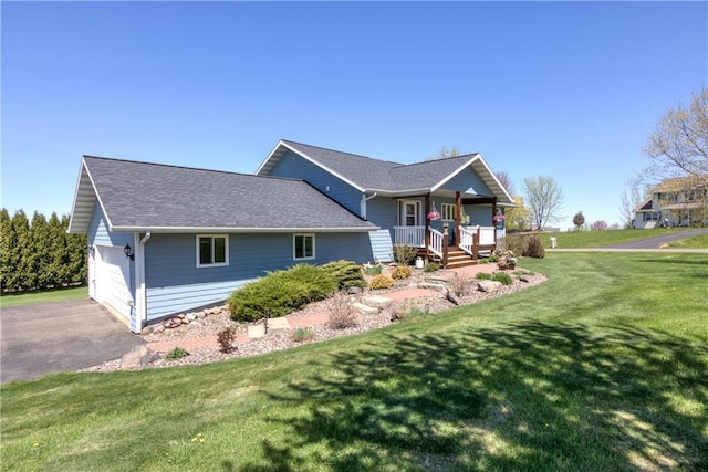 1816 186th St, Chippewa Falls, WI 54729 - ranch-style home featuring a porch, a front lawn, driveway, and roof with shingles