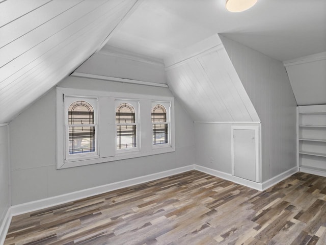 4101 N 14th St, Milwaukee, WI 53209 - additional living space featuring wood finished floors, lofted ceiling, and baseboards