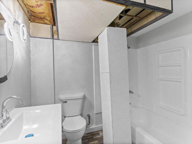 4101 N 14th St, Milwaukee, WI 53209 - bathroom with a sink, wood finished floors,  shower combination, and toilet