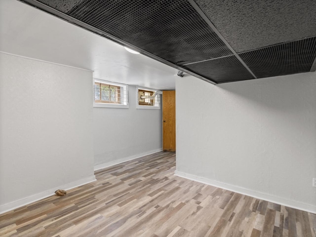 4101 N 14th St, Milwaukee, WI 53209 - basement featuring wood finished floors and baseboards