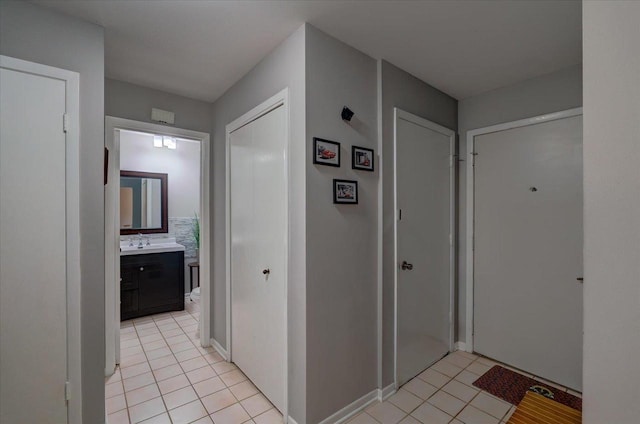 3514 Valley Ridge Rd, Middleton, WI 53562 - corridor featuring light tile patterned floors and a sink