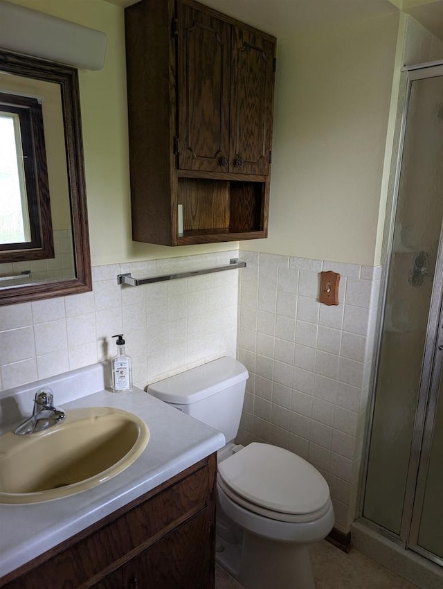 1741 Heuss Ave, Weston, WI 54476 - bathroom with tile walls, a stall shower, vanity, toilet, and a wainscoted wall