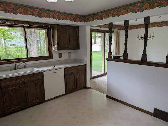 1741 Heuss Ave, Weston, WI 54476 - kitchen with dishwasher, a sink, light countertops, baseboards, and dark brown cabinets