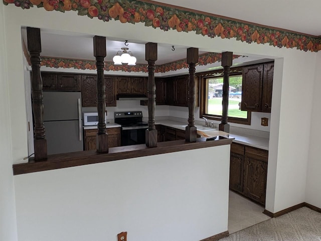 1741 Heuss Ave, Weston, WI 54476 - kitchen featuring freestanding refrigerator, range with electric stovetop, white microwave, under cabinet range hood, and dark brown cabinetry