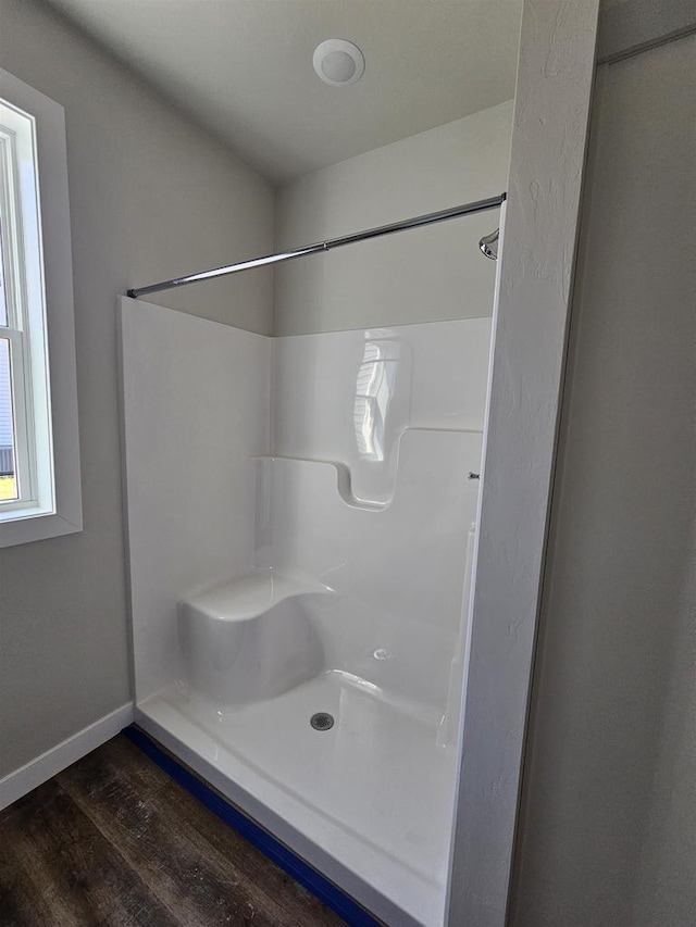 1203 Crescent, Green Bay, WI 54313 - bathroom featuring wood finished floors, a shower, and baseboards