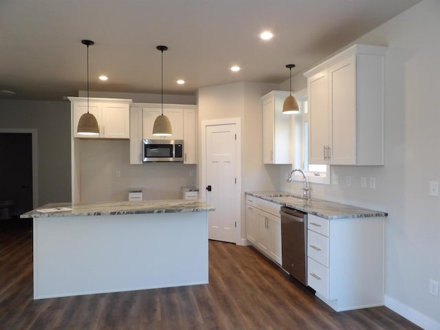 1203 Crescent, Green Bay, WI 54313 - kitchen featuring appliances with stainless steel finishes, a sink, dark wood-style flooring, white cabinets, and recessed lighting