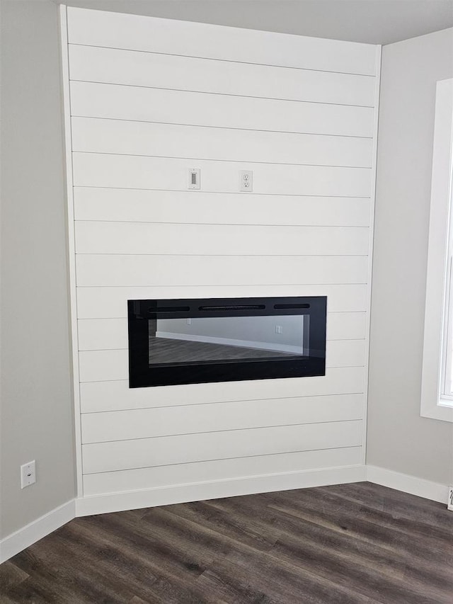 1203 Crescent, Green Bay, WI 54313 - detailed view of a fireplace, wood finished floors, and baseboards