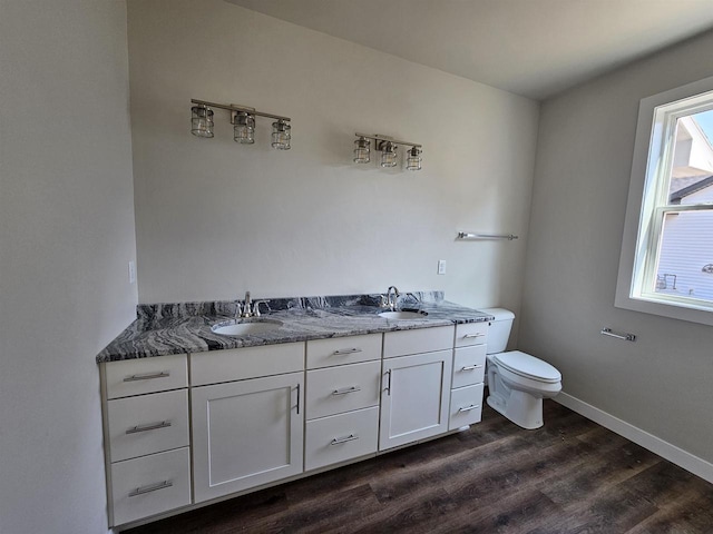 1203 Crescent, Green Bay, WI 54313 - bathroom with wood finished floors, double vanity, toilet, and baseboards