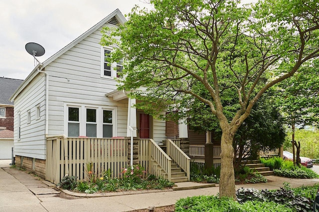 1605 E Webster Pl, Milwaukee, WI 53211 - view of front of home with a garage and covered porch