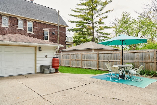 1605 E Webster Pl, Milwaukee, WI 53211 - fenced backyard featuring a patio area