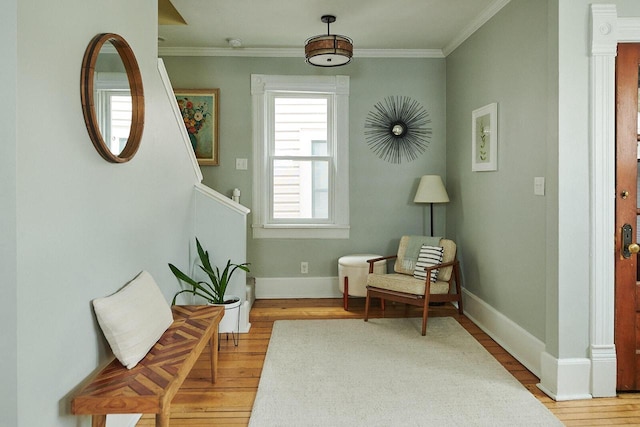 1605 E Webster Pl, Milwaukee, WI 53211 - living area featuring light wood-type flooring, crown molding, and baseboards